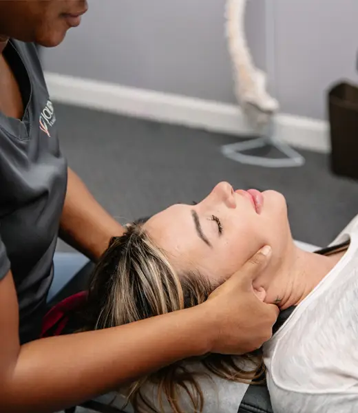 Chiropractor Roswell GA Keisha Bates Adjusting Patients Neck
